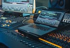 Modern Music Record Studio Control Desk with Laptop Screen Showing User Interface of Digital Audio Workstation Software Equalizer Mixer and Professional Equipment Faders Sliders Record Close up Foto Adobe Gorodenkoff